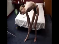 Skinny teen puts oil on her body